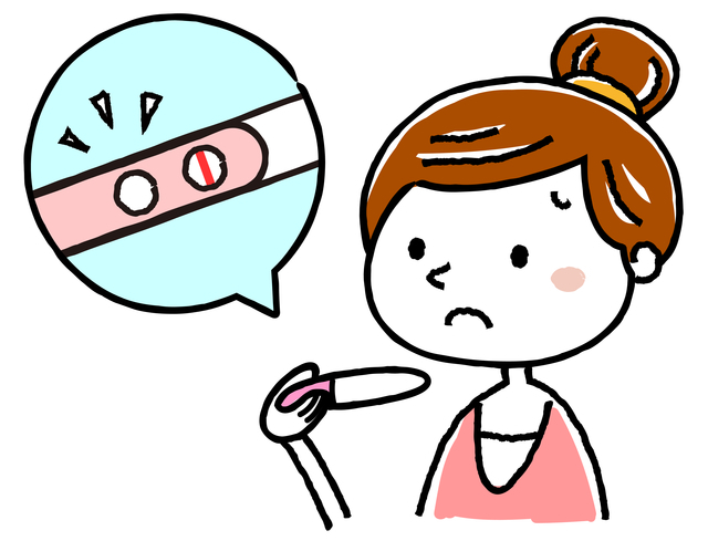 妊娠検査薬を見る女性,妊娠,高温期,