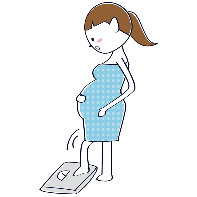 体重計と妊婦,妊娠9ヶ月,